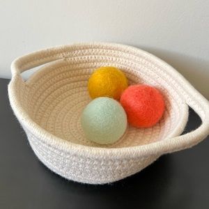Treasure basket with felt balls lovevery
